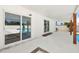 Spacious, covered outdoor patio featuring sliding glass doors and view of the pool at 4675 26Th N Ave, St Petersburg, FL 33713
