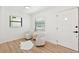 Light and bright sitting area with two club chairs and wood flooring throughout at 4675 26Th N Ave, St Petersburg, FL 33713