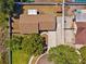 Aerial view of home showcasing the roof, backyard, driveway, and surrounding landscaping at 506 Spring Tree Ct, Tarpon Springs, FL 34689