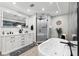 Modern bathroom with a soaking tub, stylish vanity, and a glass-enclosed shower, designed for comfort at 506 Spring Tree Ct, Tarpon Springs, FL 34689