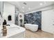 Luxury bathroom with a soaking tub, sleek fixtures, and modern lighting for a spa-like experience at 506 Spring Tree Ct, Tarpon Springs, FL 34689