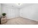Bedroom with neutral carpet, and a shuttered closet at 506 Spring Tree Ct, Tarpon Springs, FL 34689