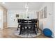 Bright dining area with modern lighting and a unique stone accent wall, perfect for Gathering meals at 506 Spring Tree Ct, Tarpon Springs, FL 34689
