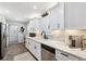 Bright kitchen with white cabinets, stainless steel appliances, and elegant countertops, perfect for cooking at 506 Spring Tree Ct, Tarpon Springs, FL 34689