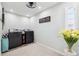 Practical laundry room with modern washer, dryer, and charming decorative details at 506 Spring Tree Ct, Tarpon Springs, FL 34689