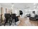Stylish living space with modern amenities and open layout to the dining area and outdoor access at 506 Spring Tree Ct, Tarpon Springs, FL 34689