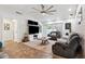 Inviting living room with a large television, fireplace, and comfortable seating for relaxation at 506 Spring Tree Ct, Tarpon Springs, FL 34689