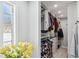 Well-organized walk-in closet with custom shelving and plenty of hanging space at 506 Spring Tree Ct, Tarpon Springs, FL 34689