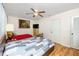 Comfortable bedroom featuring a ceiling fan, wood floors, and a window offering natural light at 5915 18Th N St # 11, St Petersburg, FL 33714