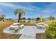 Inviting community area with seating near the pond, perfect for relaxing and socializing at 5915 18Th N St # 11, St Petersburg, FL 33714