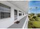 Exterior condo corridor with palm tree views, covered walkways and easy access to well-maintained grounds at 5915 18Th N St # 11, St Petersburg, FL 33714