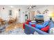 Cozy living room with ceiling fan, view to dining, wood floors, and comfortable seating arrangement at 5915 18Th N St # 11, St Petersburg, FL 33714
