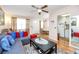 Inviting living room featuring wood floors, neutral walls, dining view, and comfortable seating at 5915 18Th N St # 11, St Petersburg, FL 33714