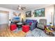 Comfortable living room featuring wood floors, neutral walls, attractive decor, and ample seating at 5915 18Th N St # 11, St Petersburg, FL 33714
