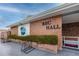 Charming brick recreation hall with a welcoming entrance and beautiful landscaping at 5915 18Th N St # 11, St Petersburg, FL 33714