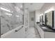 Luxurious bathroom featuring marble finishes, spacious shower, and modern fixtures at 5958 Talon Preserve Dr, Nokomis, FL 34275