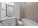 A neutral-toned bathroom offers a bathtub, shower, sink, and toilet at 5958 Talon Preserve Dr, Nokomis, FL 34275