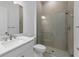 A bright bathroom features a walk-in shower, sink, and toilet at 5958 Talon Preserve Dr, Nokomis, FL 34275