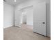 A bright bedroom offers neutral tile floors and an open doorway at 5958 Talon Preserve Dr, Nokomis, FL 34275