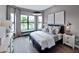 Cozy bedroom featuring natural light, stylish furniture, and decorative accents at 5958 Talon Preserve Dr, Nokomis, FL 34275