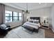 Bright bedroom with stylish gray decor and large window with outdoor views at 5958 Talon Preserve Dr, Nokomis, FL 34275