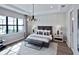 Serene bedroom features a large window with natural light and stylish decor at 5958 Talon Preserve Dr, Nokomis, FL 34275
