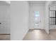Bright entryway featuring tile floors, glass front door, and a large window at 5958 Talon Preserve Dr, Nokomis, FL 34275