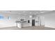 Bright kitchen with white cabinets, an island, and stainless steel appliances at 5958 Talon Preserve Dr, Nokomis, FL 34275