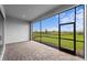 The screened lanai has beautiful brick pavers and overlooks a lush green lawn at 5958 Talon Preserve Dr, Nokomis, FL 34275