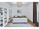 Stylish office with built-in shelves, modern desk, and natural light at 5958 Talon Preserve Dr, Nokomis, FL 34275