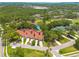 Gorgeous aerial showcases the home's proximity to the golf course and well-maintained landscaping at 60 Woodridge Cir, Oldsmar, FL 34677