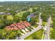 Scenic aerial view showcases the property in a lush, manicured community, with a golf course nearby at 60 Woodridge Cir, Oldsmar, FL 34677