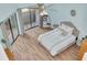 Bright bedroom with balcony access, ceiling fan, and stylish decor at 60 Woodridge Cir, Oldsmar, FL 34677