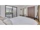 Cozy bedroom with sliding door to outdoor deck area at 60 Woodridge Cir, Oldsmar, FL 34677