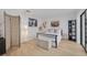 Bright bedroom features warm wood-look flooring and large windows at 60 Woodridge Cir, Oldsmar, FL 34677