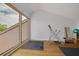 Bonus room with a large window and exercise equipment at 60 Woodridge Cir, Oldsmar, FL 34677