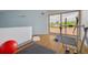 Bonus room with exercise equipment, a large window, and light wood floors at 60 Woodridge Cir, Oldsmar, FL 34677