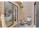 Exterior shot of private deck with seating area attached to bedroom at 60 Woodridge Cir, Oldsmar, FL 34677