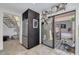 View of kitchen leading to private outdoor deck and staircase at 60 Woodridge Cir, Oldsmar, FL 34677