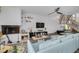 Inviting living area with a modern fireplace, cozy seating, and easy access to staircase at 60 Woodridge Cir, Oldsmar, FL 34677