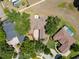 An aerial view shows the property with a driveway, landscaping, and proximity to nearby homes and greenery at 607 Vintage Way, Brandon, FL 33511