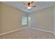 Cozy bedroom featuring neutral walls, carpet flooring, a ceiling fan, and a window with blinds at 607 Vintage Way, Brandon, FL 33511