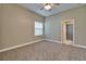 Bright bedroom with a ceiling fan, carpet flooring, neutral walls, and a window with blinds at 607 Vintage Way, Brandon, FL 33511