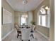 Dining room features chandelier lighting, a decorative ceiling and neutral paint at 607 Vintage Way, Brandon, FL 33511