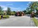 Entrance gate to the community featuring a brick structure with black iron gates at 607 Vintage Way, Brandon, FL 33511