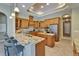 Well-lit kitchen with granite countertops, stainless steel appliances, and custom wood cabinetry at 607 Vintage Way, Brandon, FL 33511