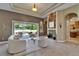 Bright living room with stone fireplace and sliding glass doors to the outdoor area at 607 Vintage Way, Brandon, FL 33511