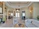 Bright open floor plan features a stone fireplace, high ceilings, and elegant archways leading to the dining room at 607 Vintage Way, Brandon, FL 33511