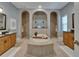 Spa-like bathroom with soaking tub, dual vanities, and walk-in shower at 607 Vintage Way, Brandon, FL 33511