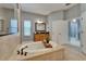 Elegant bathroom showing soaking tub, vanity, and glass enclosed shower at 607 Vintage Way, Brandon, FL 33511